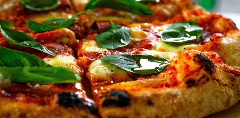 Pizza 64 Temple's signature Butter Chicken Pizza - Indian fusion pizza in Calgary